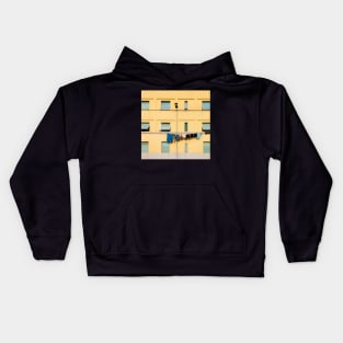 Laundry Drying on Washing Line Against Yellow Building Facade in Italy Kids Hoodie